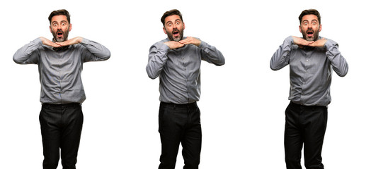Middle age man, with beard and bow tie happy and surprised cheering expressing wow gesture
