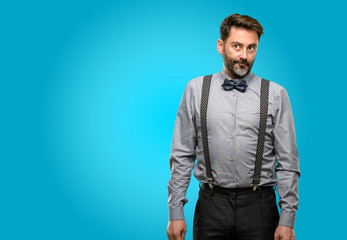 Middle age man, with beard and bow tie doubt expression, confuse and wonder concept, uncertain future