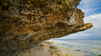 Beautiful wild tropical beach near Anda with granite rocks. Bohol Island. Philippines.
