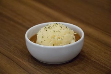mash potato on cup wood background