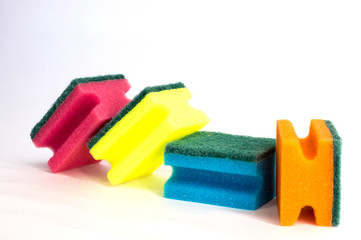 multicolored dish washing sponge on white background in different positions