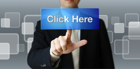 ボタンを押すビジネスマン（ここをクリック）