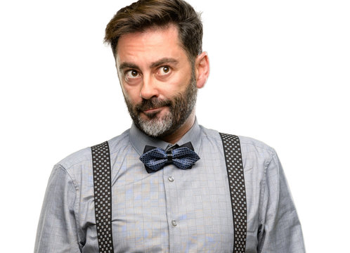 Middle age man, with beard and bow tie doubt expression, confuse and wonder concept, uncertain future isolated over white background