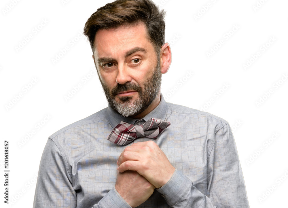 Poster Middle age man, with beard and bow tie crying depressed full of sadness expressing sad emotion isolated over white background