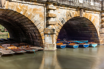 Classic wooden boats  docked on the river in Oxford - 1