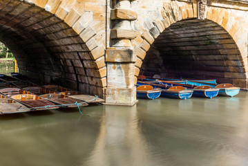 Classic wooden boats  docked on the river in Oxford - 5