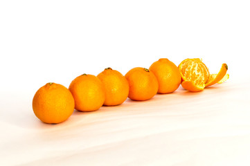 tangerines, citrus several pieces lie in different order on white background