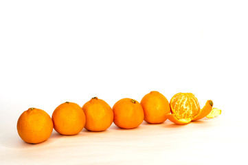 tangerines, citrus several pieces lie in different order on white background