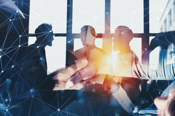Handshaking business person in office with network effect. concept of teamwork and partnership....