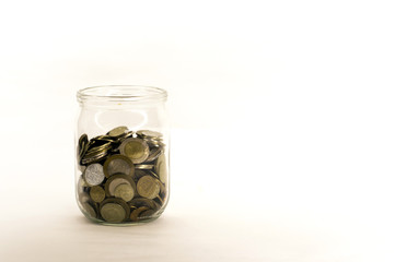 coin money in glass jar, white background in different positions