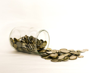 coin money in glass jar, white background in different positions