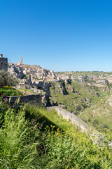 Fototapeta premium Vertical View of the Sassi of Matera on Blue Sky Background. Matera, South of Italy