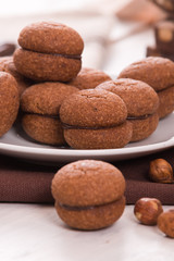Hazelnut shortbread sandwiches filled with chocolate cream. 