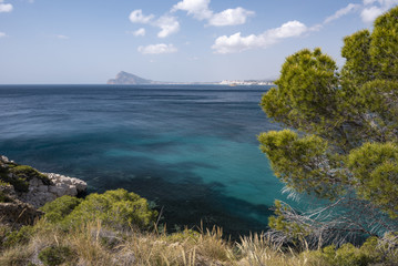 Fototapeta na wymiar Between Altea and Calpe the Mascarat area with its turquoise water coastline, Altea, Costa Blanca, Alicante province, Spain