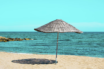 Straw umbrella near the sea