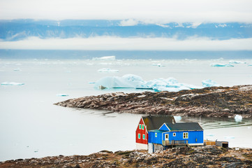 Colorful houses on the shore of Atlantic ocean in Greenland © smallredgirl