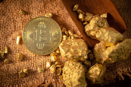 Gold bitcoin physical and Gold nugget grains. Concept mining cryptography