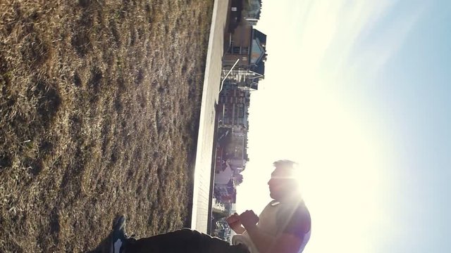 Urban acrobatics - teenager performing somersault outdoor