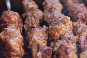 Fresh meat shish kebab fried and smoked on a charcoal grill. Roast the meat close up