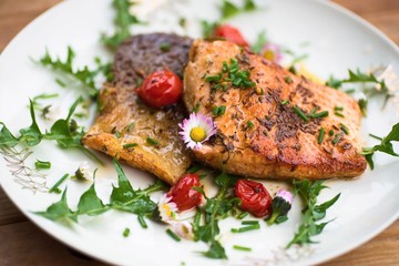 Red salmon trout,tomato and dandelion leaf.