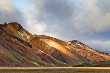 Fotobehang Icelandic mountain landscape at sunset. Colorful volcanic mountains in the Landmannalaugar geotermal area. One of the parts of Laugavegur trail © Oleg Totskyi