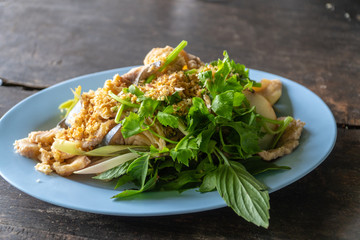 Steamed river fish with garlic and herb.