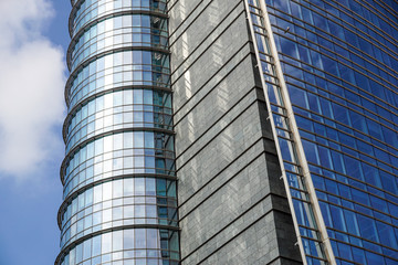 Fototapeta premium modern blue glass wall of office building