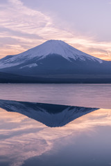 Fototapeta na wymiar Mountain Fuji and Yamanakako ice lake with reflection in evening winter