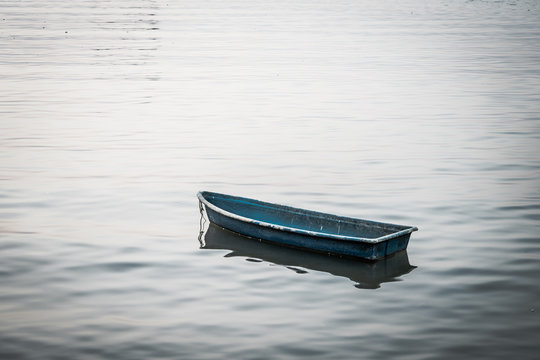 Small boat floating on the sea