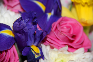 Fototapeta na wymiar Bouquet of flowers. Roses, chrysanthemums, irises