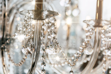 Rich luxury crystal chandelier close-up. Glamour background with copy space