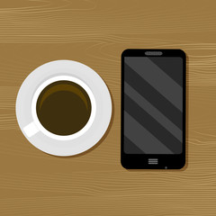 Cup of coffee and smartphone on table