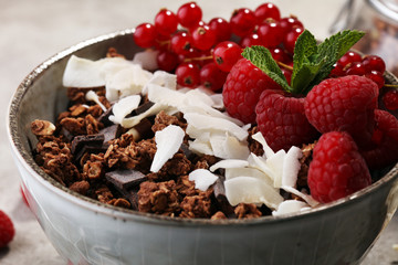 granola healthy breakfast with natural yogurt, muesli and berries