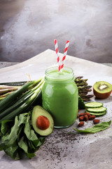 Healthy green smoothie and ingredients