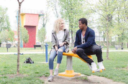 two cheerful mixed race people