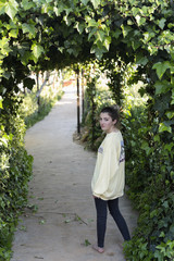 Fototapeta premium Portrait of a young teenage girl in a garden.
