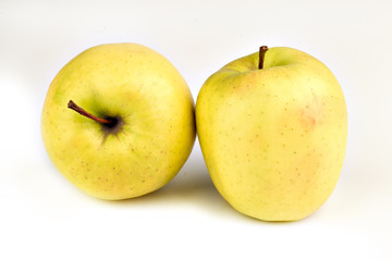 ripe yellow apples on a white background