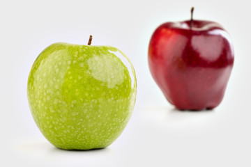 Ripe red  and green apples on white background