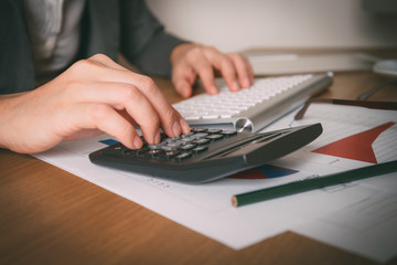 Business woman analyzing investment charts