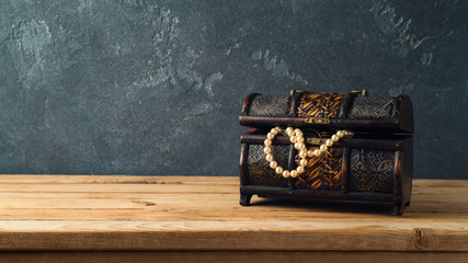 Treasure chest on wooden table