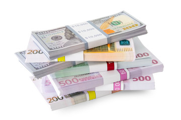 Pile of money - dollar and euro banknotes on white.