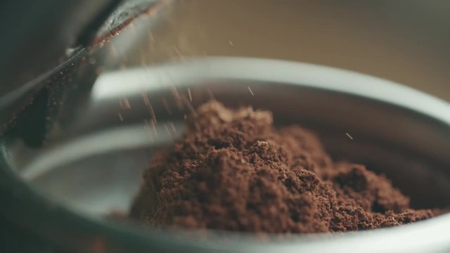 close-up, slow motion, coffee machine holder fill up flickered coffee espresso machine