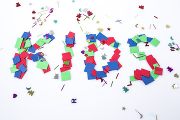 Write kids made with multicolor paper in a white background