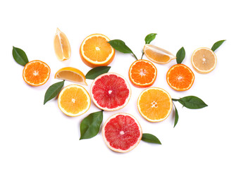 Citrus fruits isolated on white background. Isolated citrus fruits. Pieces of lemon, pink grapefruit and orange isolated on white background, with clipping path. Top view.