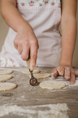 female woman artisan baker at home baking a sweet dough cookies, series from the whole process available