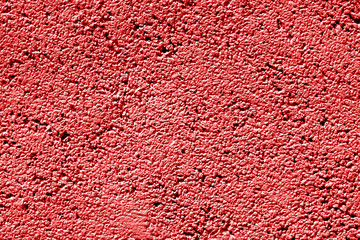 Cement wall texture in red tone.