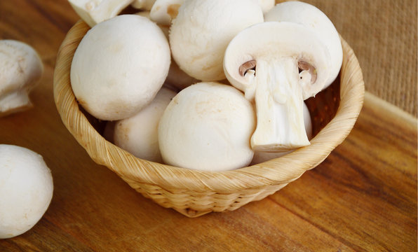 Agaricus bisporus or portobello mushroom on wooden floor