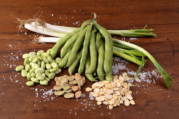Fresh, dried and shelled broad beans with scallions for a vegetarian cuisine