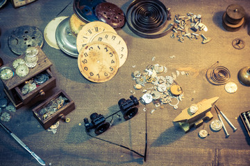 Vintage watchmakers workshop full of clocks and tools