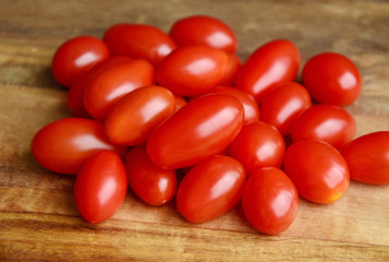 Roma tomatoes on wooden background